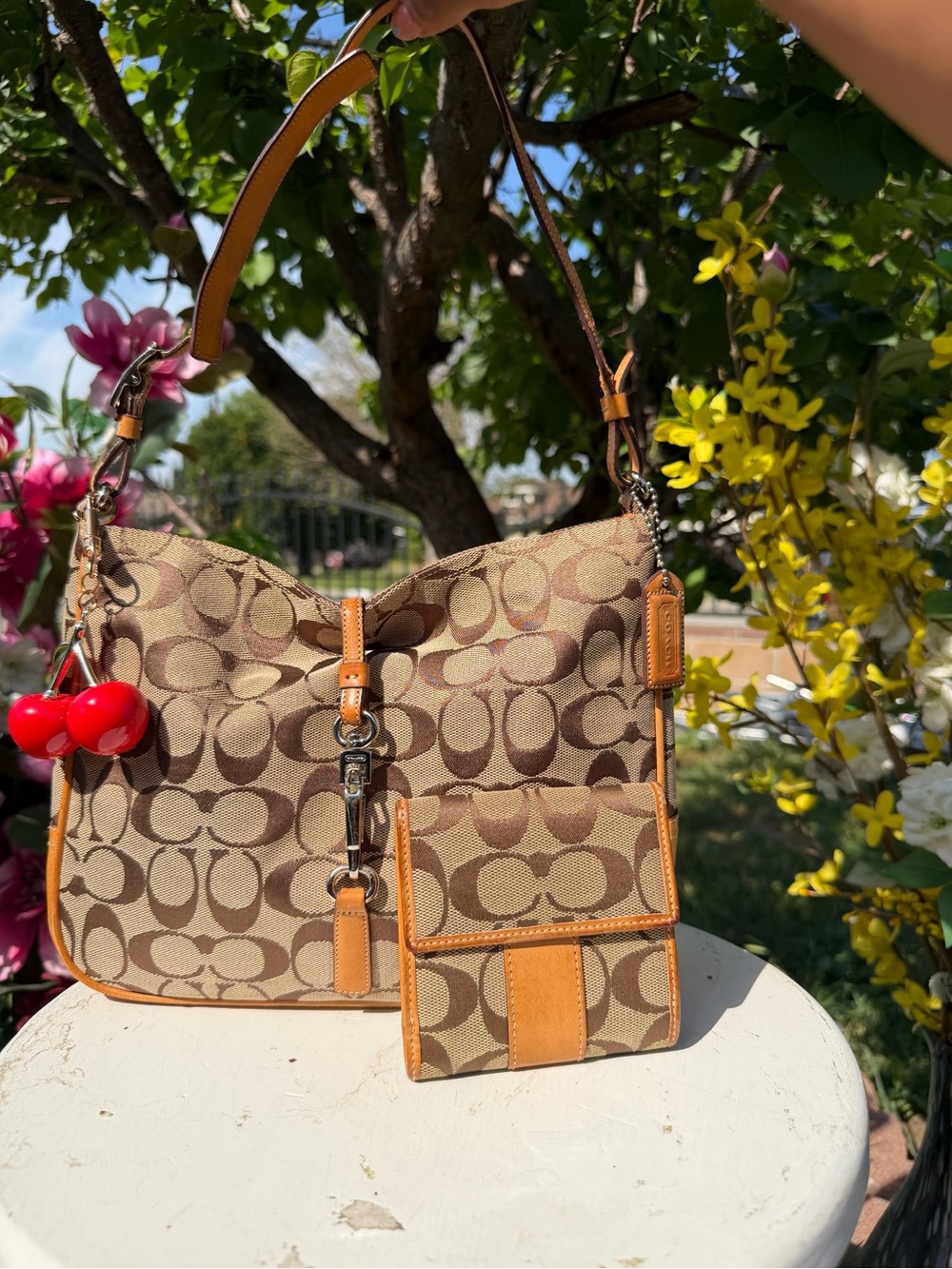 Coach Tan Monogram Shoulder Bag with Orange Trim and Red Cherry Charm